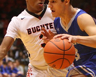 William D. Leiws The vindicator  Poland's Braeden O' Shaughnessy (3) drives around Buchtel's Martavian Johnson(3).