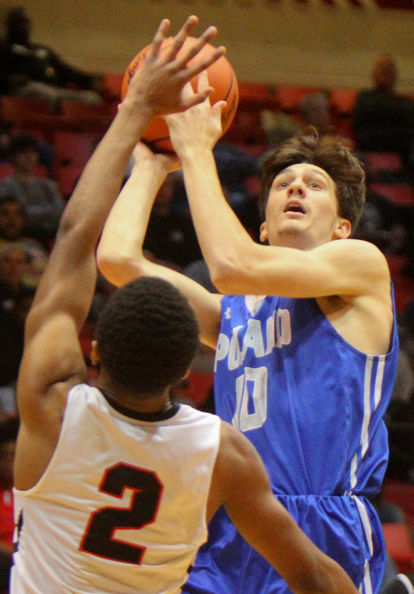 William D. Lewis The Vindicator Poland's Daniel Kramer(10) shoots past Buchtel's Jonathan King(2)).