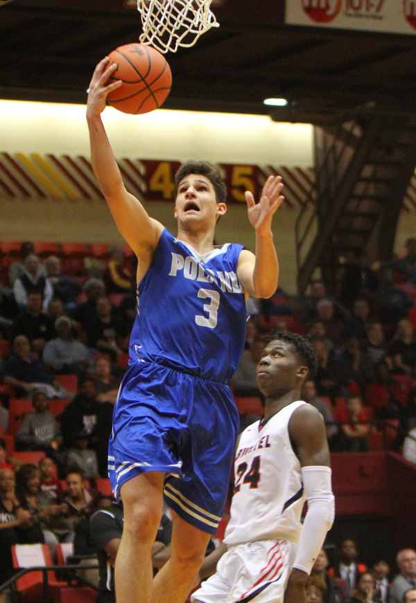 William D. Lewis The Vindicator Poland's Braeden O'Shaughnessy(3) shoots past Buchtel's Chris Livingston (24).