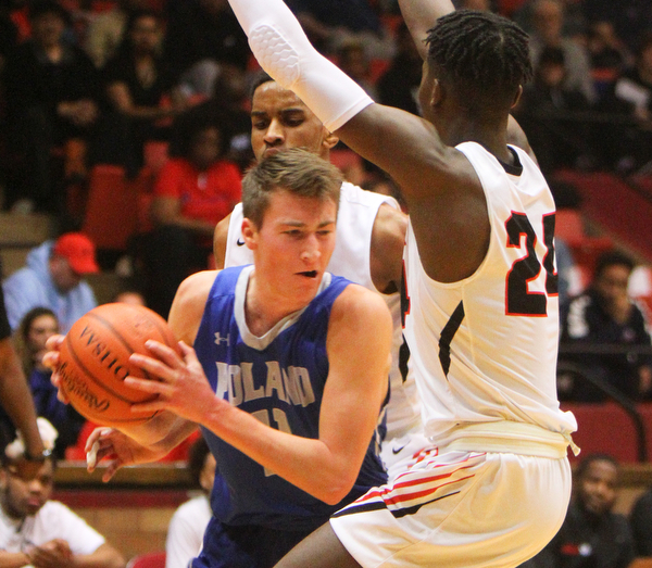 William D. Lewis The Vindicator Poland's Collin Todd(11)drives past Buchtel's Chris Livingston (24).