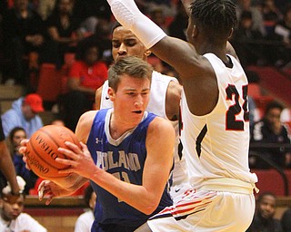 William D. Lewis The Vindicator Poland's Collin Todd(11)drives past Buchtel's Chris Livingston (24).