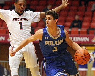 William D. Lewis The Vindicator Poland's Braeden O'Shaughnessy(3)) drives past Buchtel's Tkai Coleman (1).