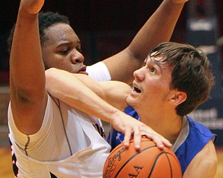 William D. Lewis The Vindicator  Poland's Daniel Kramer(10) is covered by Buchtel's Anthony Hunt Jr(30).