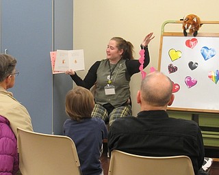 Neighbors | Jessica Harker.Rhonda Monroe, a youth librarian at the Boardman library read Valentine's Day themed stories to children gathered at the Night Owl event on Feb. 14.