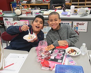 Neighbors | Jessica Harker.Third-graders Yousef Albdlur and Landon Lewis enjoyed ice cream sundaes provided by Boardman's Parent Teacher Organization on Feb. 14 to celebrate Valentine's Day.