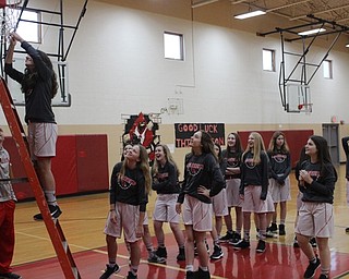 Neighbors | Abby Slanker.Members of the Canfield Village Middle School eighth-grade basketball team celebrated their 2019 AAC championship by cutting down the net in the school’s gym on Feb. 18.