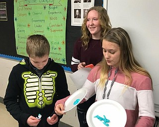 Neighbors | Submitted.Poland WEB leaders demonstrate to sixth graders how tooth paste is easily squeezed out of the tube, but hard to put back in, using it as a metaphor for negative words.