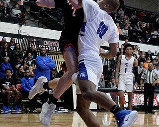 Springfield's Drew Clark (2) gets tightly defended by Richmond's Jamarr Talbert Jr. (10) during Friday night's Regional Championship matchup at the Canton Fieldhouse.  Dustin Livesay   |   The Vindicator  3/15/19  Canton.