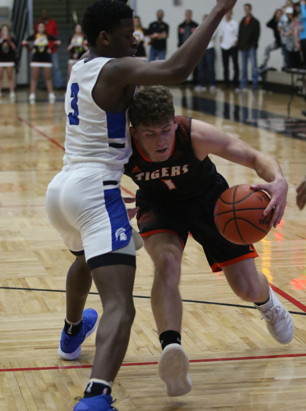Evan Ohlin (1) of Springfield tries to drive through RichmondÕs Gbolahan Adio (3) during the first half of Friday night's Regional Championship matchup at the Canton Fieldhouse.  Dustin Livesay   |   The Vindicator  3/15/19  Canton.