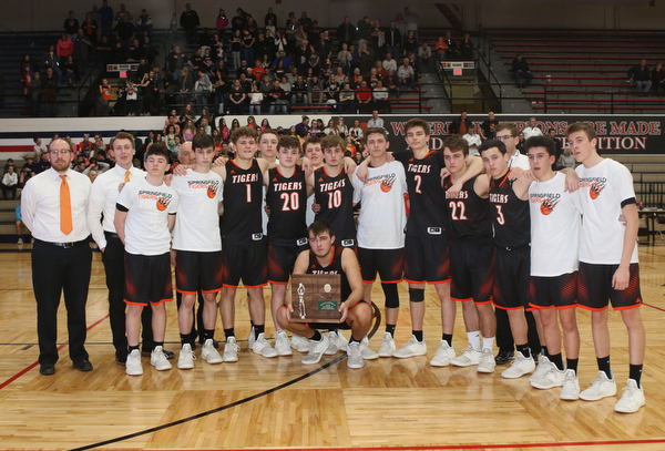 The Springfield High School basketball team poses with the Regional Runner-up trophy after losing to Richmond 46-43 at the Canton Fieldhouse on Friday night.  Dustin Livesay  |  The Vindicator  3/15/19  Canton