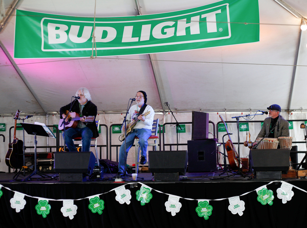 From left, Tom Sailor, Sonny Hrehovcick, and Jeff Spencer of Shoe Shine Boys perform at Shamrock the Block on West Federal Street on Sunday afternoon. EMILY MATTHEWS | THE VINDICATOR