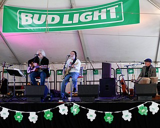From left, Tom Sailor, Sonny Hrehovcick, and Jeff Spencer of Shoe Shine Boys perform at Shamrock the Block on West Federal Street on Sunday afternoon. EMILY MATTHEWS | THE VINDICATOR