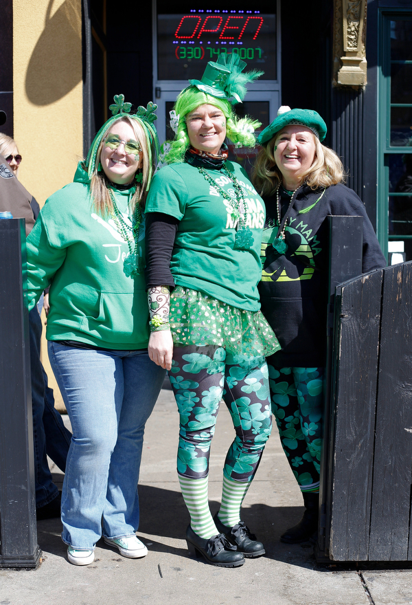 From left, Janelle Anderson, of Hermitage, Trisha Paine, of Franklin, and Susan Anderson, of Sharpsville, pose for a photo outside of O'Donold's at Shamrock the Block on Sunday afternoon. EMILY MATTHEWS | THE VINDICATOR