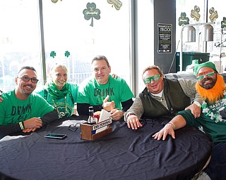From left, Tom Dama, of Boardman, Darlene Treharn, of Boardman, Ken Dama, of Kauai, Hawaii, Tim Klacik, of Youngstown, and Josh Kershner, of Canfield, pose for a photo inside the Federal during Shamrock the Block on Sunday afternoon. EMILY MATTHEWS | THE VINDICATOR