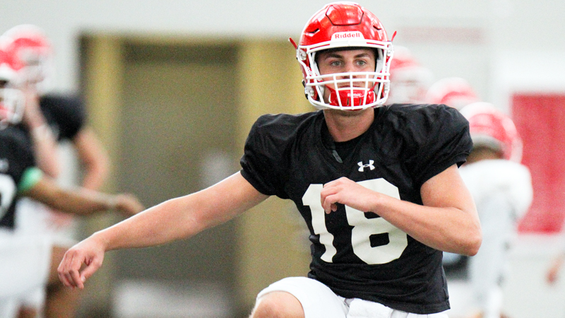 Mark Waid, one of Youngstown State University's quarterbacks, warms up during a spring practice Monday.
