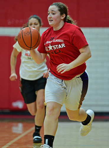 CANFIELD, OHIO - MARCH 19, 2019: Champion's Abby White dribbles up court during the first half of the 49th annual Al Beach Classic, Tuesday night at Canfield High School. DAVID DERMER | THE VINDICATOR