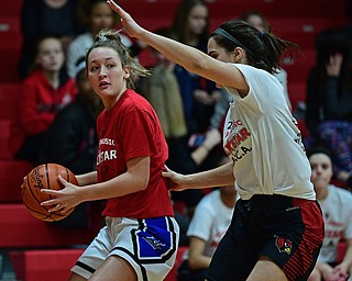 CANFIELD, OHIO - MARCH 19, 2019: Lisbon's Chloe Smith looks to pass against Canfield's Serena Sammarone during the first half of the 49th annual Al Beach Classic, Tuesday night at Canfield High School. DAVID DERMER | THE VINDICATOR