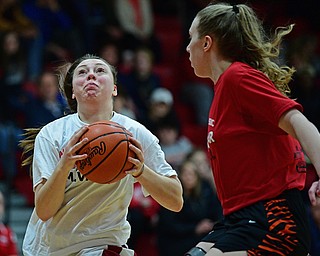 CANFIELD, OHIO - MARCH 19, 2019: Mooney's Conchetta Rinaldi goes to the basket against Howland's Kayla Clark during the second half of the 49th annual Al Beach Classic, Tuesday night at Canfield High School. DAVID DERMER | THE VINDICATOR