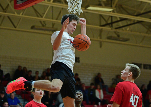 CANFIELD, OHIO - MARCH 19, 2019: South Range's Jackson Anderson stares at Howland's Nathan Barrett after a dunk during the second half of the 49th annual Al Beach Classic, Tuesday night at Canfield High School. DAVID DERMER | THE VINDICATOR