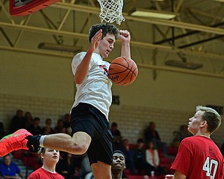 CANFIELD, OHIO - MARCH 19, 2019: South Range's Jackson Anderson stares at Howland's Nathan Barrett after a dunk during the second half of the 49th annual Al Beach Classic, Tuesday night at Canfield High School. DAVID DERMER | THE VINDICATOR