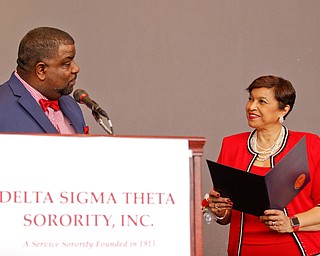 Youngstown Mayor Tito Brown presents Beverly E. Smith, the National President and CEO of Delta Sigma Theta Sorority, Inc., a key to the city during the Delta Sigma Theta Sorority, Inc. Youngstown Alumnae Chapter Founders Day Celebration on Saturday afternoon in YSU's DeBartolo Stadium Club. EMILY MATTHEWS | THE VINDICATOR