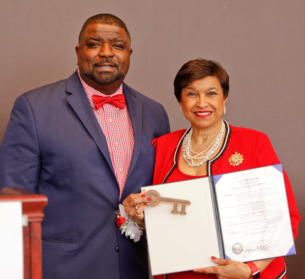 Youngstown Mayor Tito Brown presents Beverly E. Smith, the National President and CEO of Delta Sigma Theta Sorority, Inc., a key to the city during the Delta Sigma Theta Sorority, Inc. Youngstown Alumnae Chapter Founders Day Celebration on Saturday afternoon in YSU's DeBartolo Stadium Club. EMILY MATTHEWS | THE VINDICATOR
