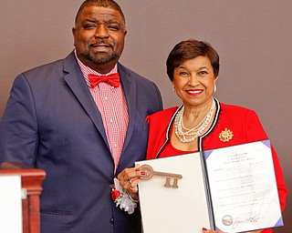 Youngstown Mayor Tito Brown presents Beverly E. Smith, the National President and CEO of Delta Sigma Theta Sorority, Inc., a key to the city during the Delta Sigma Theta Sorority, Inc. Youngstown Alumnae Chapter Founders Day Celebration on Saturday afternoon in YSU's DeBartolo Stadium Club. EMILY MATTHEWS | THE VINDICATOR