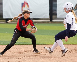 YSU's Tatum Christy tags out KSU's Jen Cader during the first game of their double header at Covelli Sports Complex on Wednesday afternoon. EMILY MATTHEWS | THE VINDICATOR