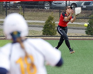 YSU's Yazmine Romero misses a fly ball during the first game of their double header against KSU at Covelli Sports Complex on Wednesday afternoon. EMILY MATTHEWS | THE VINDICATOR