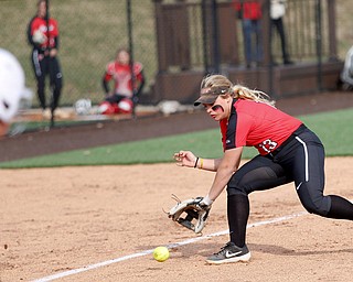 YSU's Nikki Saibene tries to field a ground ball hit by KSU's Hailey Hopkins during the first game of their double header at Covelli Sports Complex on Wednesday afternoon. Saibene fumbled with the ball and Hopkins was safe at first. EMILY MATTHEWS | THE VINDICATOR