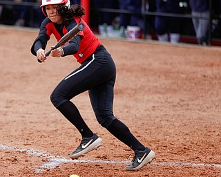 YSU's Yazmine Romero lays down a bunt during the second game of their double header against KSU at Covelli Sports Complex on Wednesday afternoon. EMILY MATTHEWS | THE VINDICATOR