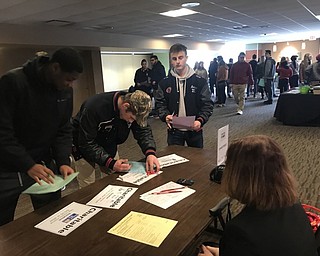 Neighbors | Jessica Harker.Students examine the charitable giving portion of the experience day budgeting exercise Feb. 19 hosted at Youngstown State University.