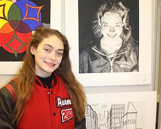 Neighbors | Abby Slanker.Canfield High School sophomore Aurora Fares attended the opening night reception of the Canfield Schools art show, where her self portrait was on display, at the Canfield library on Feb. 21.