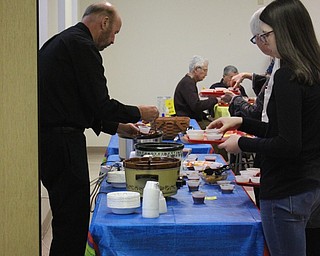Neighbors | Abby Slanker.Phil May, a member of the Canfield United Methodist Church Congregational Life Committee, served up some chili to attendees of the chili cook-off on Feb. 24.  .