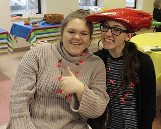 Neighbors | Abby Slanker.Courtney Rapp (left) and Holly Eberly had some fun at the Canfield United Methodist Church Congregational Life Committee chili cook-off on Feb. 24.