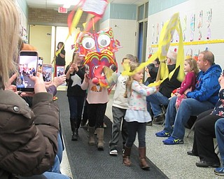 Neighbors | Jessica Harker.Preschoolers at the Early Childhood Learning Center in Austintown created a paper drago and streamers they used to perform the Dance of the Dragon for their family members Feb. 28.