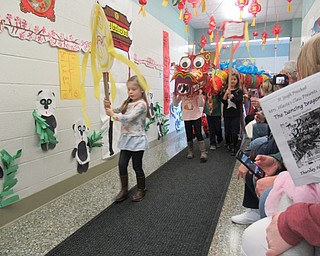 Neighbors | Jessica Harker.Preschoolers performed the Dance of the Dragon Feb. 28 to celebrate the Chinese New Year, ringing in the year of the Pig.