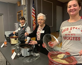 Neighbors | Submitted.Boardman Lions Club volunteers, from left, Judith Young, Sandra Janis and Laura Ahlswede got ready to dish out sweet potatoes, baked beans and a noodle casserole for students to taste..