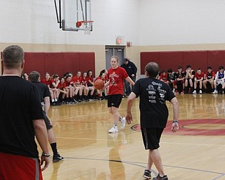 Neighbors | Abby Slanker.A member of the Canfield Village Middle School seventh-grade girls basketball team eyes up her staff competition during the school’s fourth annual Students Versus Staff Basketball Game on March 8.