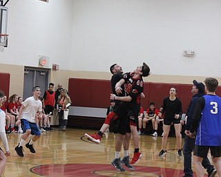 Neighbors | Abby Slanker.The Canfield Village Middle School eighth-grade boys basketball team tipped off the second half of the school’s fourth annual Students Versus Staff Basketball Game on March 8.