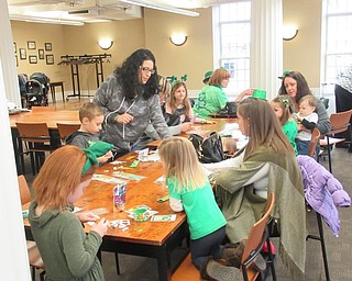 Neighbors | Jessica Harker.Children and their families gathered at the Poland library March 16, reading books, working on crafts and playing games at the annual St. Patrick's Day celebration.