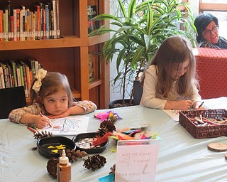 Neighbors | Jessica Harker.Children gathered at Fellows Riverside Garden Feb. 28 for the new Crafty Critters event, where preschoolers colored photos and created pinecone owls.