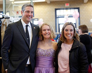 Shianna Gibbons, 16, of Liberty, poses with Congressman Tim Ryan and his wife Andrea at the annual Kyrsten's Kloset, where anyone can get a free prom or formal dress and accessories as long as they sign a promise not to drink and drive on Saturday at the former Roosevelt Elementary in Hubbard. EMILY MATTHEWS | THE VINDICATOR