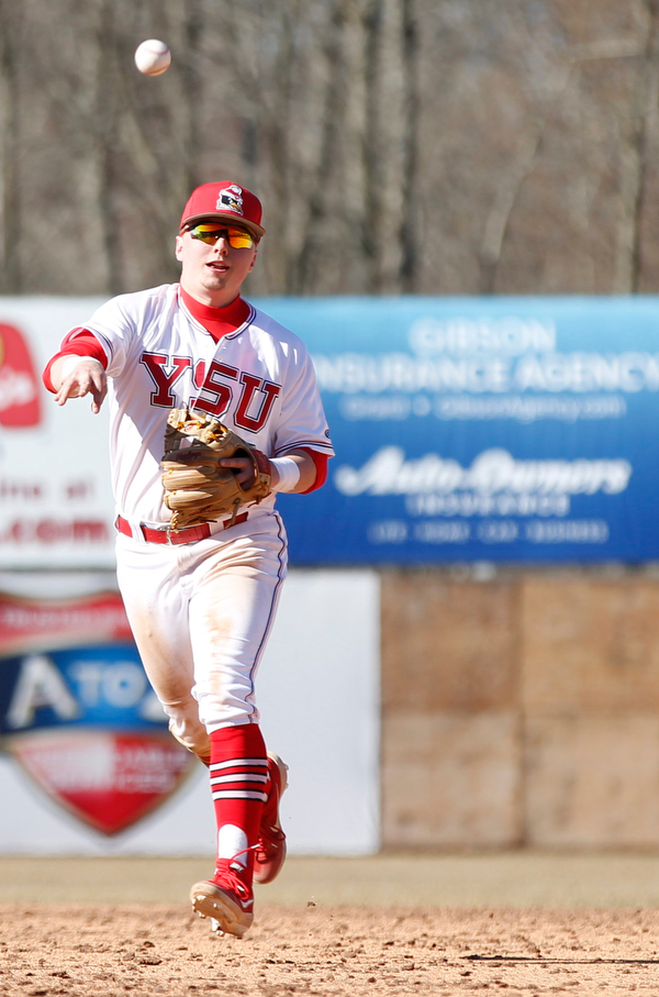 YSU's second baseman Drew Dickerson throws the ball to first baseman Trevor Wiersma during the first game of their double header against Oakland on Saturday at Eastwood Field. EMILY MATTHEWS | THE VINDICATOR