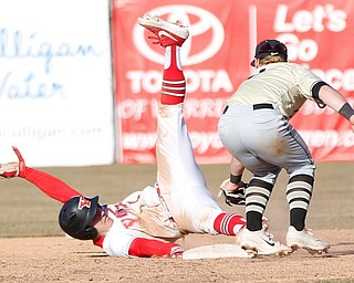 YSU's Lucas Nasonti slides safely into second as Oakland's second baseman Mario Camilletti misses the ball during the second game of their double header on Saturday at Eastwood Field. EMILY MATTHEWS | THE VINDICATOR