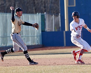 YSU's Web Charles gets caught in a rundown as Oakland's third baseman Ronnie Krsolovic chases him with the ball during the second game of their double header against Oakland on Saturday at Eastwood Field. EMILY MATTHEWS | THE VINDICATOR