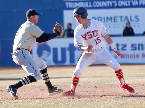 YSU's Web Charles gets caught in a rundown as Oakland's third baseman Ronnie Krsolovic lunges to tag him during the second game of their double header against Oakland on Saturday at Eastwood Field. EMILY MATTHEWS | THE VINDICATOR