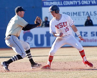 YSU's Web Charles gets caught in a rundown as Oakland's third baseman Ronnie Krsolovic lunges to tag him during the second game of their double header against Oakland on Saturday at Eastwood Field. EMILY MATTHEWS | THE VINDICATOR