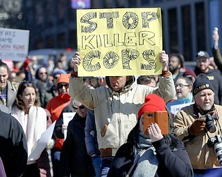Marchers move through the streets Saturday in Pittsburgh. The group was calling for justice the day after former East Pittsburgh police officer Michael Rosfeld was acquitted in the homicide trial where he was charged with shooting and killing 17-year-old Antwon Rose II last summer near Pittsburgh. 