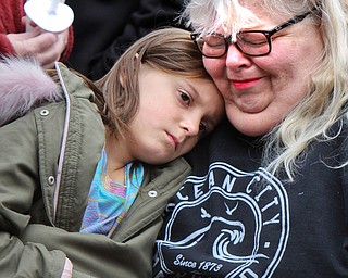 William D. Lewis The Vindicator Brenda Tenney, of Mineral Ridge and grandmother of Campbell boy killed in car crash consoles her niece Allison Lowe, 7, during a vigil Sunday 3-24-19 at Roosevelt Park  in Campbell.